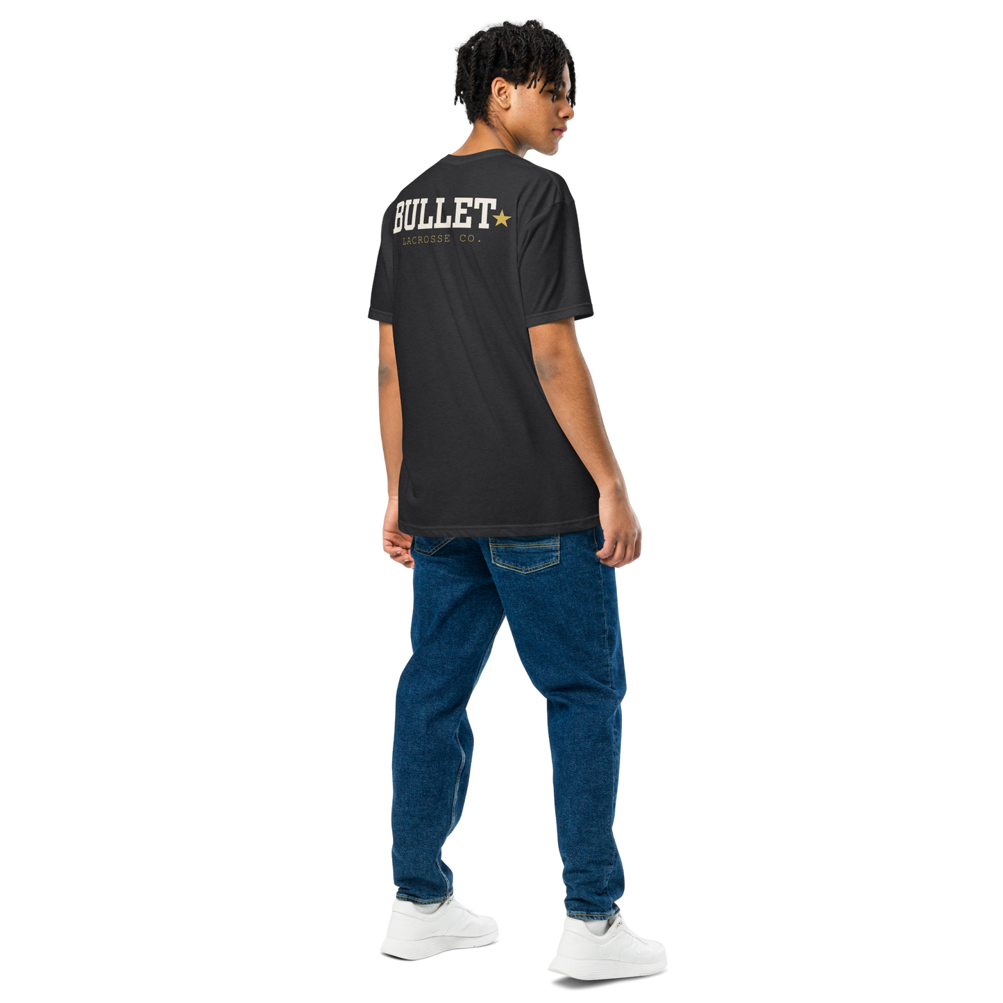 Athlete wearing black Field Tee with oversized Bullet Lacrosse back graphic