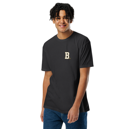Athlete wearing black Field Tee with minimalist varsity B chest logo
