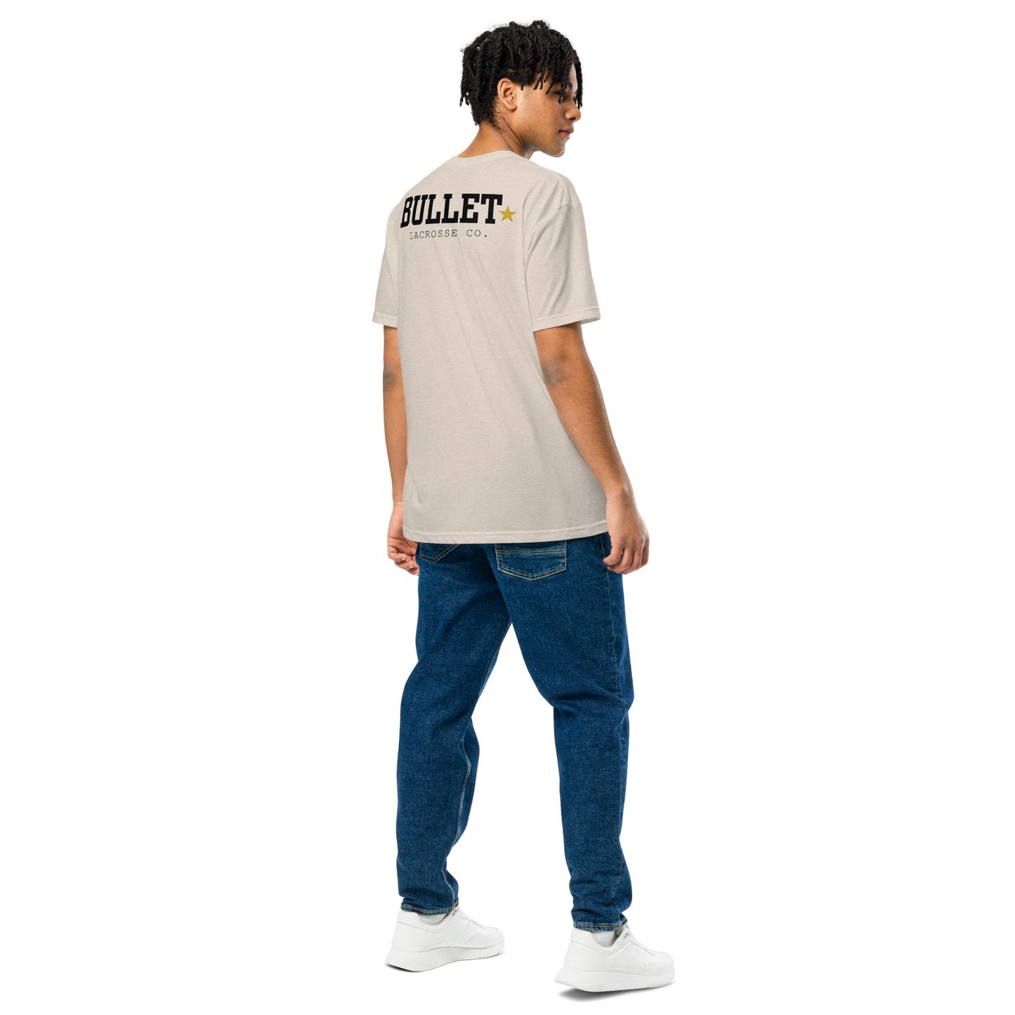 Athlete wearing bone Field Tee with oversized Bullet Lacrosse back graphic