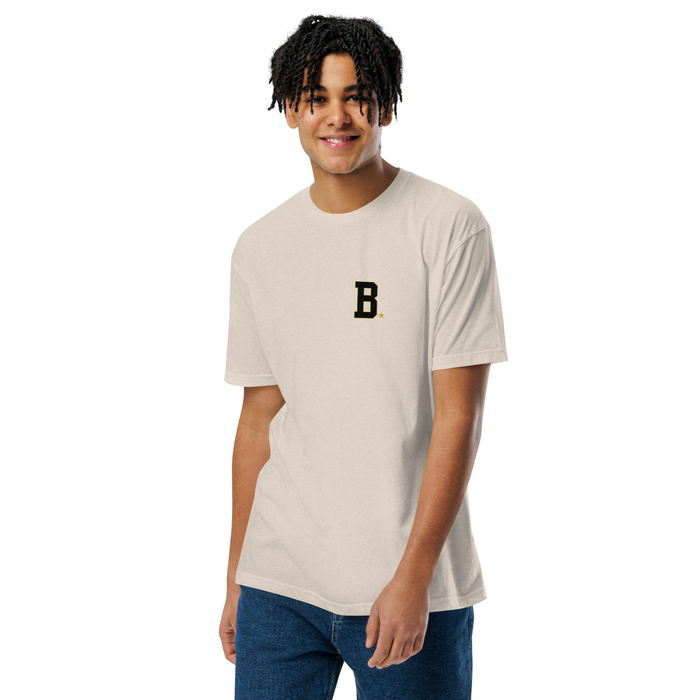 Athlete wearing bone Field Tee with minimalist varsity B chest logo